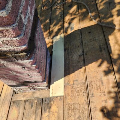 Russell Quality Roofing working to repair Failed Flashing Around Chimneys & Valleys