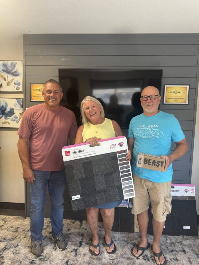 Rick Fuentes, the Project Consultant at Russell Quality Roofing, giving Don and LuAnn Wee their thank you gift for purchasing a roof through us at their Final PMT/Warranty appointment.