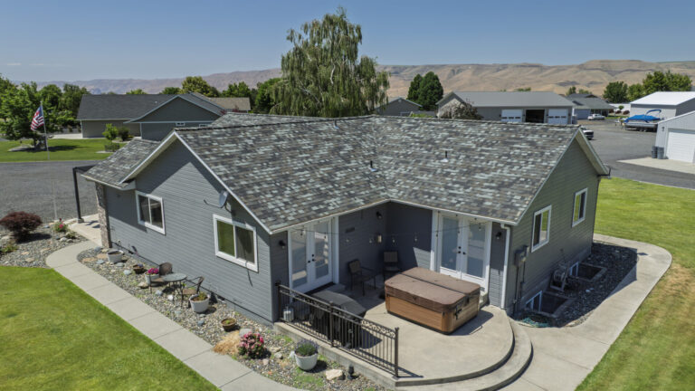 Aerial shot of a blue-toned color roofing job completed by Russell Quality Roofing