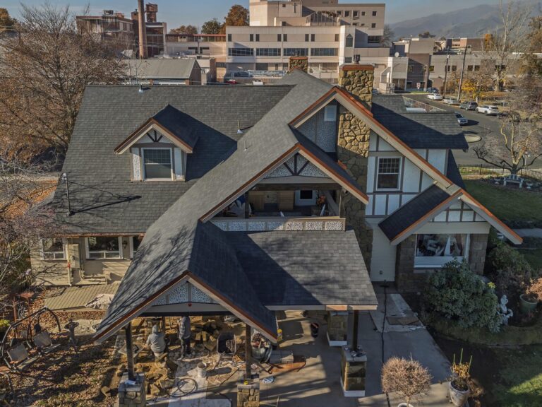Drone shot of a completed roofing project done on a large modern downtown home