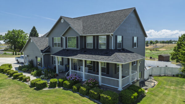 Front view photo of a residential property that underwent a roofing replacement project with Russell Quality Roofing