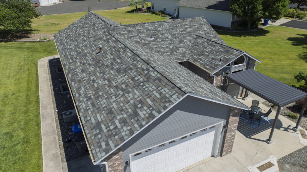 New grey shingles on a suburban home